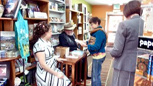 Emma Hox and Graham Hutchins 'book-buzz' with a book fan.